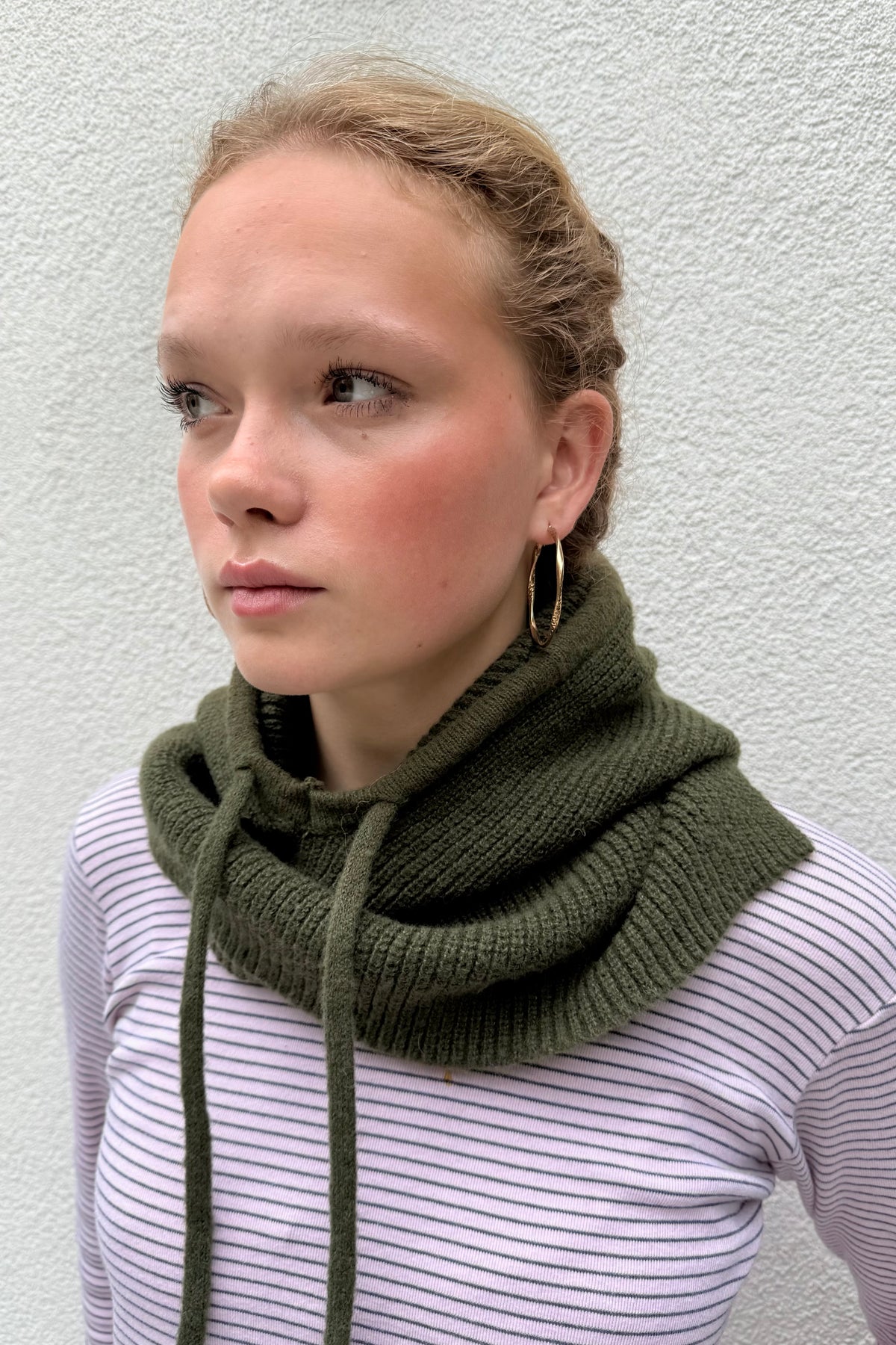 woman wearing a khaki cashmere balaclava