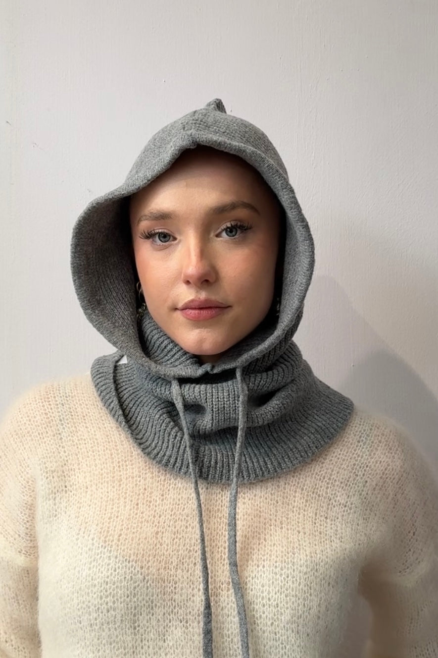 woman wearing a grey cashmere balaclava