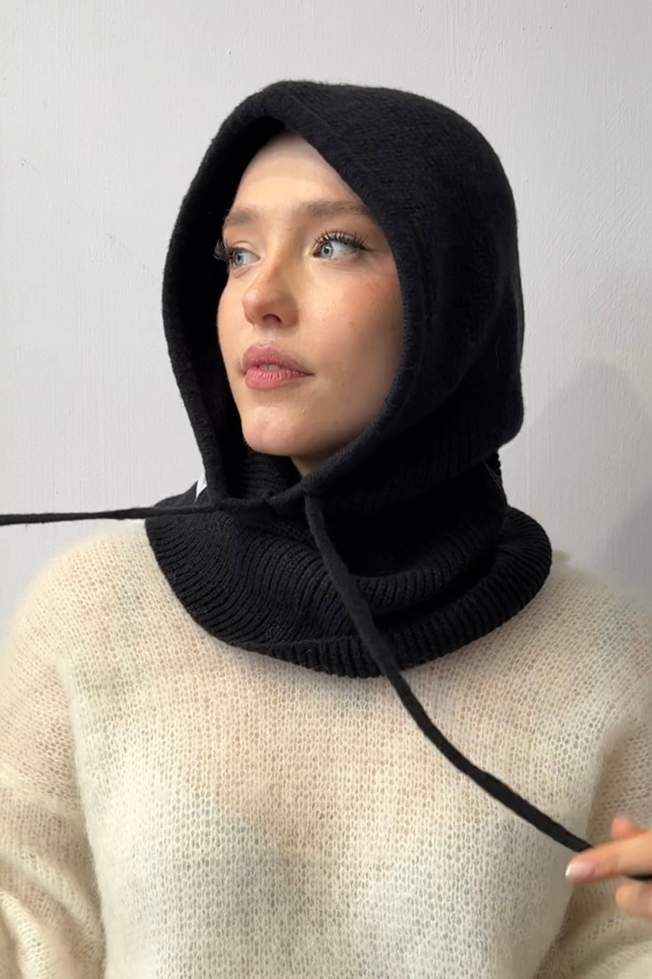 woman wearing a black cashmere balaclava