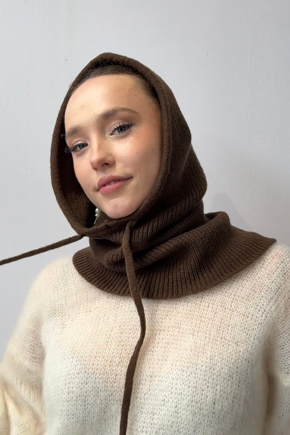 woman wearing a brown cashmere balaclava