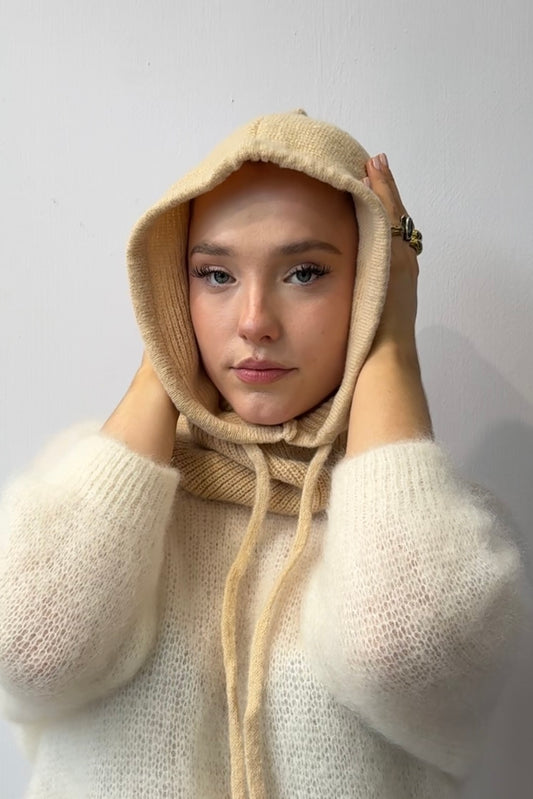 woman wearing a cream cashmere balaclava