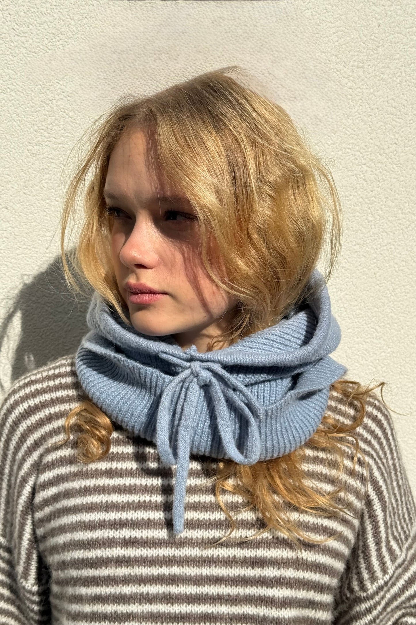 woman wearing a blue cashmere balaclava