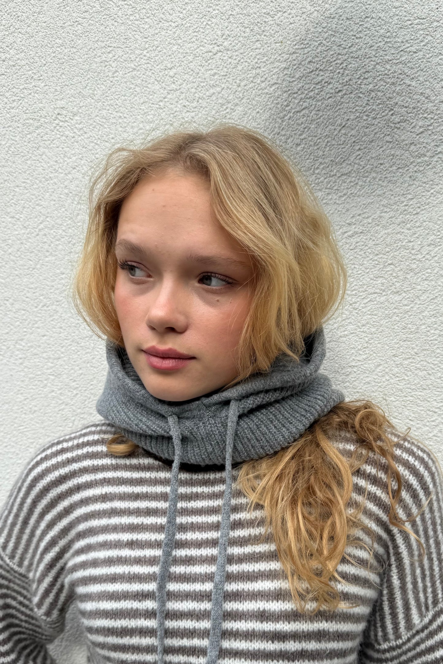 woman wearing a grey cashmere balaclava